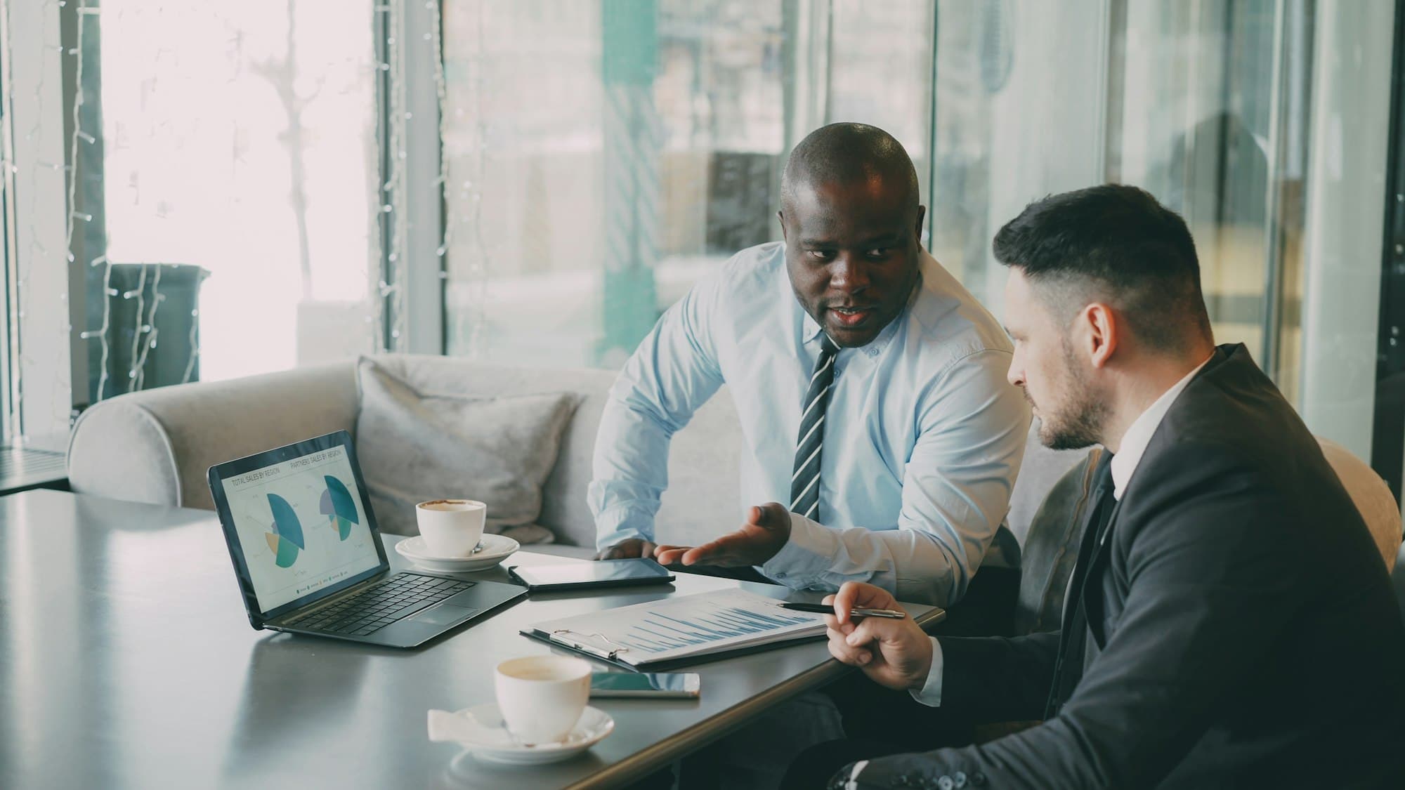 Advisors reviewing financial charts with a client
