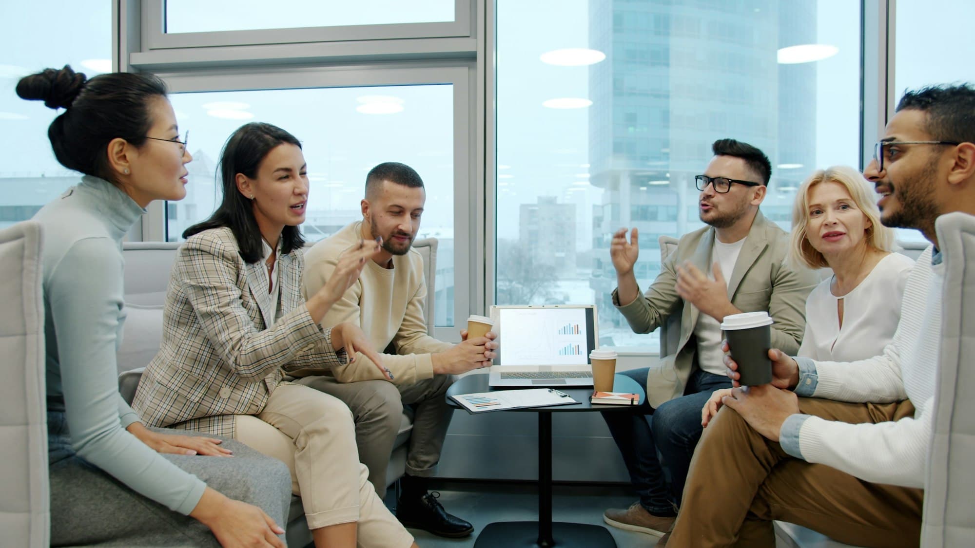 Team discussing a client engagement in a modern office